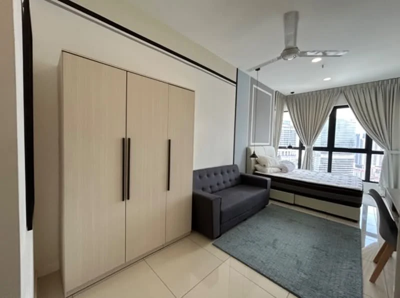Bedroom features: queen-size bed with white bedding, upholstered headboard, grey fabric sofa, built-in wardrobe with sliding doors, large floor-to-ceiling window, curtains, ceiling fan, tile flooring, area rug in light blue, decorative wall paneling; style: modern; view: city.