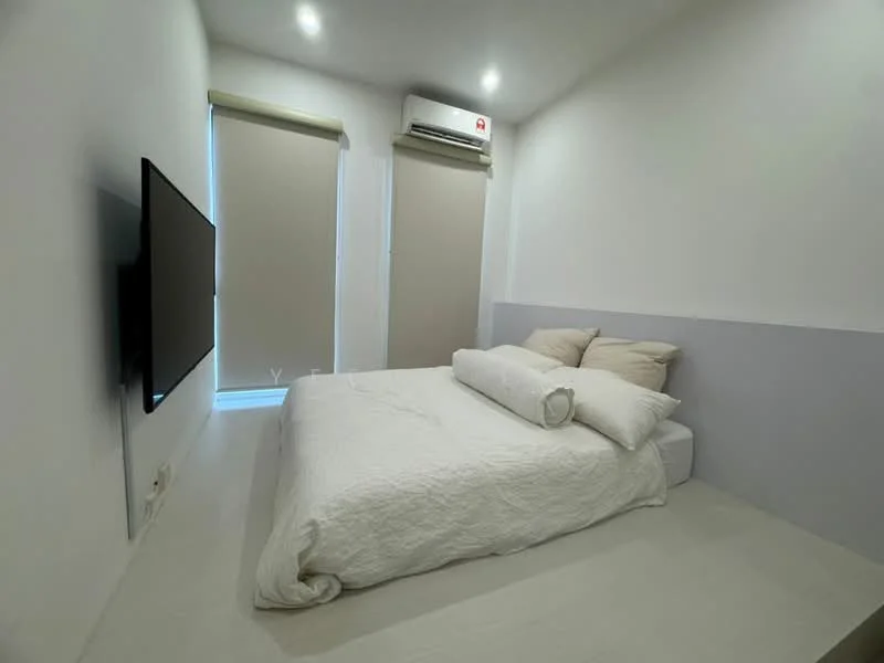 Bedroom features: queen-size bed with white bedding, two beige pillows, wall-mounted TV, light grey accent wall, white painted walls, window with roller blinds, wall-mounted split AC, light-colored flooring; style: minimalist.