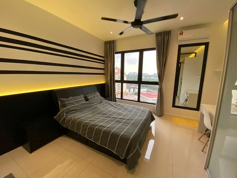 Bedroom features: king-size bed with grey bedding, black upholstered headboard, 2 bedside tables, floor-to-ceiling windows, city view, grey curtains, recessed LED downlights, ceiling fan, white walls with black accent stripes, polished tile flooring, study desk with white chair, mirror on wall; style: modern; view: city.