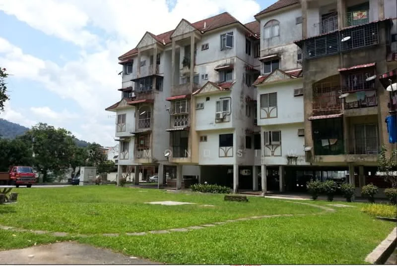 Exterior type: low-rise apartment block; features: three-storey building, balconies with metal railings, exposed concrete facade, red tiled roof, manicured lawn, landscaped garden area, parking area underneath building, surrounded by greenery, windows with grilles, some units with air conditioning units; style: modern.