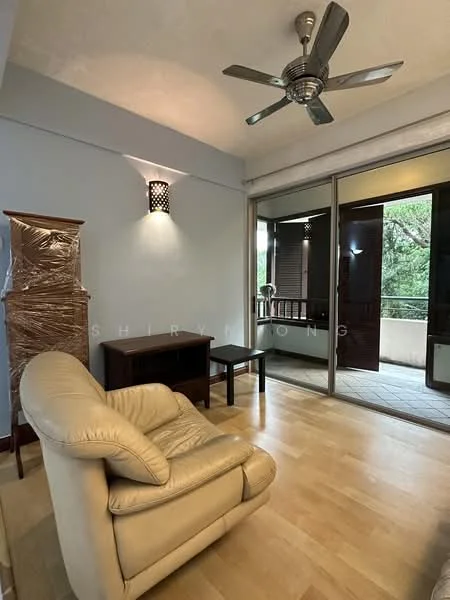 Living features: light wood flooring, blue painted walls, 5-blade ceiling fan with light, sliding glass door, balcony access, single armchair in cream leather, wooden side table, decorative wall sconce; style: modern; view: garden.