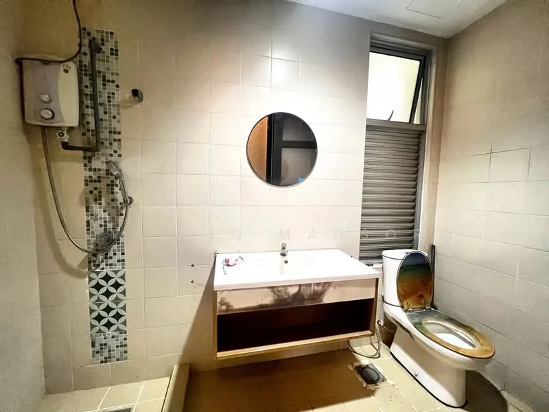 Bathroom features: white tiled walls, light beige tiled flooring, single-sink vanity with wood cabinet, round mirror, shower with wall-mounted showerhead, toilet, exposed plumbing, window with blinds.