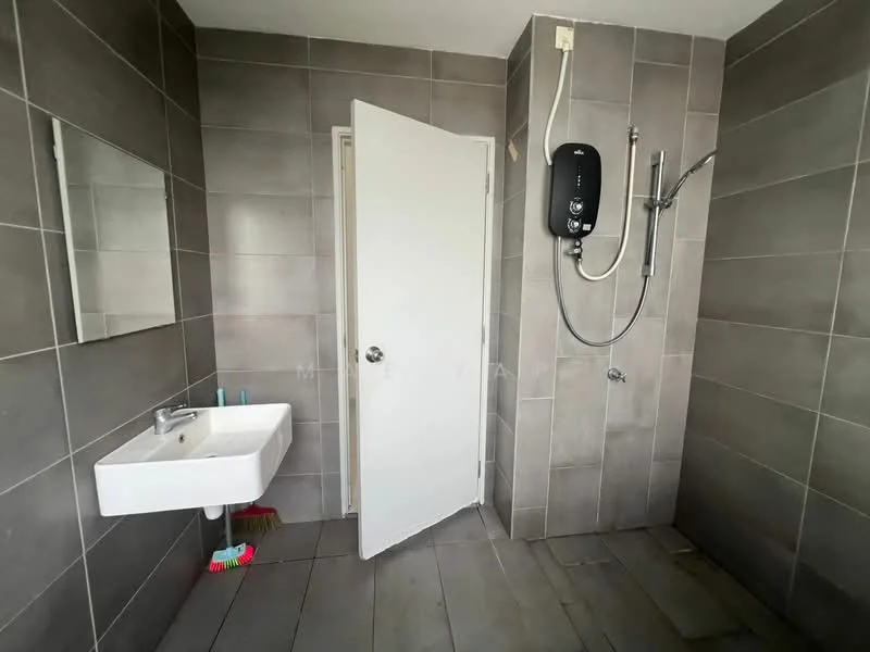 Bathroom features: grey tiled walls, grey tiled flooring, wall-mounted shower with handheld showerhead, white wall-mounted sink, mirror above sink, white door, water heater mounted on wall; style: modern.