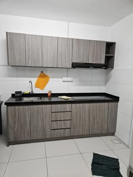 Kitchen features: grey laminate cabinetry, black granite countertop, single-bowl stainless-steel sink, chrome pull-down faucet, built-in range hood, white tiled walls, white tiled flooring, open shelving, kitchen towel hanging, can of drink on countertop, paper on countertop, area rug with geometric pattern; style: modern.