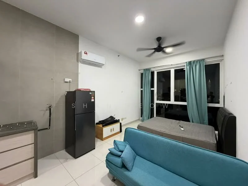 Room features: white painted walls, grey tiled accent wall, white ceiling, recessed downlights, 5-blade ceiling fan, floor-to-ceiling windows, light blue fabric sofa, queen-size bed, black upholstered headboard, grey bed linens, stainless-steel fridge, wooden storage unit, air conditioning unit; style: modern; view: city.