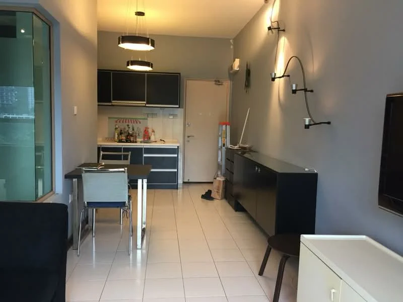 Living features: grey painted walls, white tiled flooring, recessed downlights, 2 pendant lights, black cabinetry, stainless-steel sink, built-in oven, 4-burner gas hob, kitchen island, dining table with 4 chairs, TV console, wall-mounted TV, black sofa, decorative wall sconce; style: modern.
