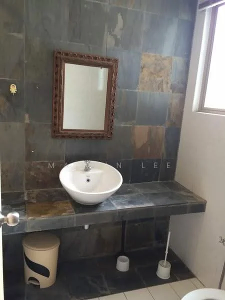 Bathroom features: wall-mounted basin, chrome faucet, framed mirror, slate tile walls, grey stone countertop, white toilet, white waste bin, floor tiles, natural light from window; style: modern.