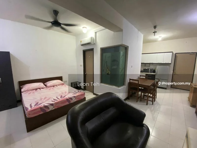 Living features: queen-size bed with floral bedding, black leather armchair, wooden dining table with four chairs, kitchenette with built-in cabinets, stainless-steel fridge, microwave, built-in oven, wall-mounted split AC, white painted walls, tile flooring, ceiling fan, glass partition, recessed lighting; style: modern.