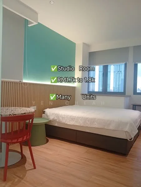 Bedroom features: queen-size bed with white bedding, wooden flooring, green accent wall, wood paneling on lower wall, large window with city view, roller blinds, round dining table, red chair, desk lamp, built-in wardrobe, recessed ceiling lights; style: modern; view: city.