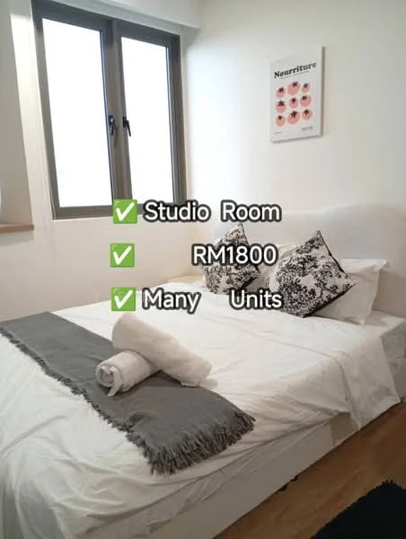 Bedroom features: queen-size bed, white bedding, black and white decorative pillows, wooden flooring, window with view, wall-mounted artwork, light-colored walls, bedside table, rolled towel; style: modern.