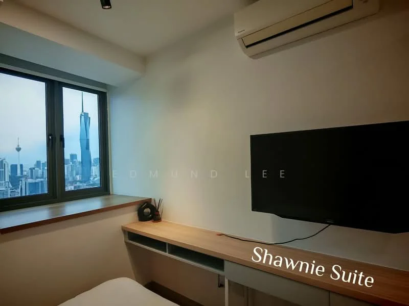 Room features: floor-to-ceiling window, city skyline view, wall-mounted TV, wooden desk, wall-mounted air conditioning unit, light-colored walls, laminate flooring; style: modern; view: city.