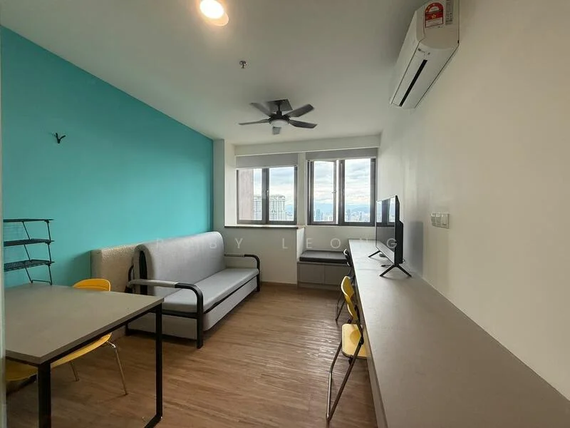 Living features: light wood flooring, blue accent wall, grey fabric sofa, 1 wall-mounted split AC, 5-blade ceiling fan, floor-to-ceiling windows, black metal shelving unit, desk with chair, TV console, city view; style: modern; view: city.