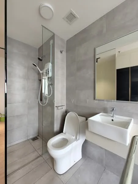 Bathroom features: grey tile flooring, grey wall tiles, glass shower enclosure, rain shower head, handheld shower, white ceramic toilet, single-sink vanity with wall-mounted faucet, framed mirror, exhaust fan, recessed lighting; style: modern.
