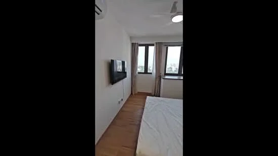 Bedroom features: wooden flooring, white painted walls, floor-to-ceiling windows, curtains, wall-mounted TV, ceiling fan, recessed lighting, queen-size bed, bedside table; style: modern; view: city.