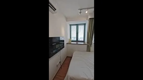 Bedroom features: wooden flooring, white painted walls, floor-to-ceiling window, green curtains, recessed downlights, air conditioning unit, bed with white bedding, built-in wardrobe, window sill with decorative items; style: modern; view: city.