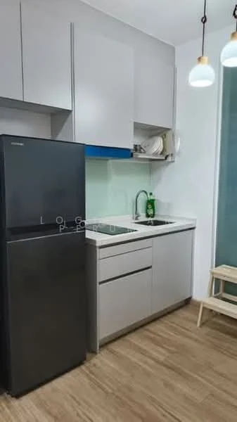 Kitchen features: grey flat-panel cabinets, white countertop, single-bowl stainless-steel sink, chrome pull-down faucet, black refrigerator, open shelving, wooden stool, green backsplash, pendant lighting; style: modern.