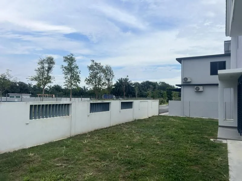 Exterior type: semi-detached house; features: white painted facade, flat roof, 2 wall-mounted split AC units, manicured lawn, fenced perimeter, concrete pathway, surrounded by greenery, playground visible in background; style: modern.