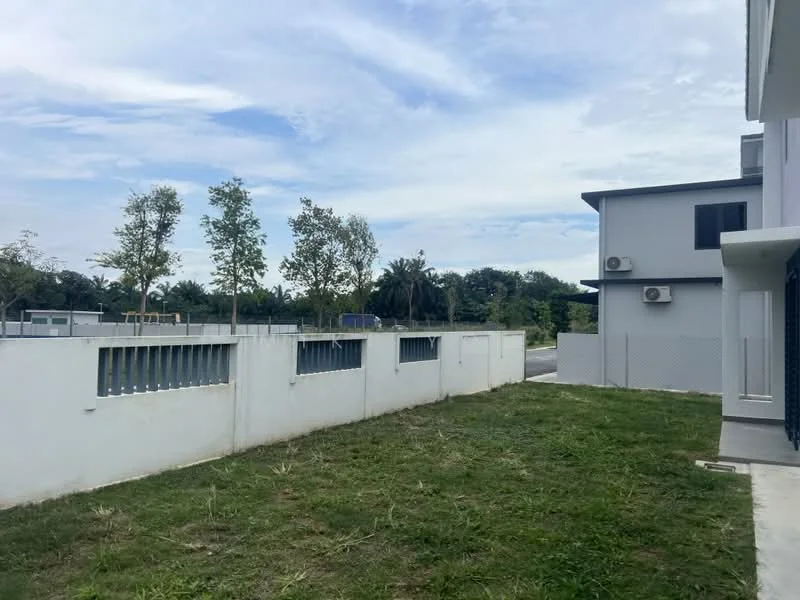 Exterior type: detached bungalow; features: white painted facade, flat roof, 2 wall-mounted split AC units, manicured lawn, concrete walkway, surrounded by mature greenery, fenced perimeter wall; style: modern.