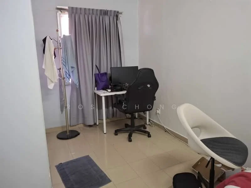 Room features: light grey painted walls, cream tiled flooring, window with sheer curtains, desk with computer monitor, black office chair, clothing rack, white chair, small area rug.