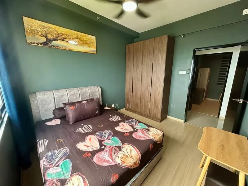 Bedroom features: green painted walls, wooden flooring, queen-size bed with patterned bedding, upholstered headboard, decorative wall art, built-in wardrobe with wood finish, ceiling fan, window with blue curtains, study desk, area rug; style: modern.