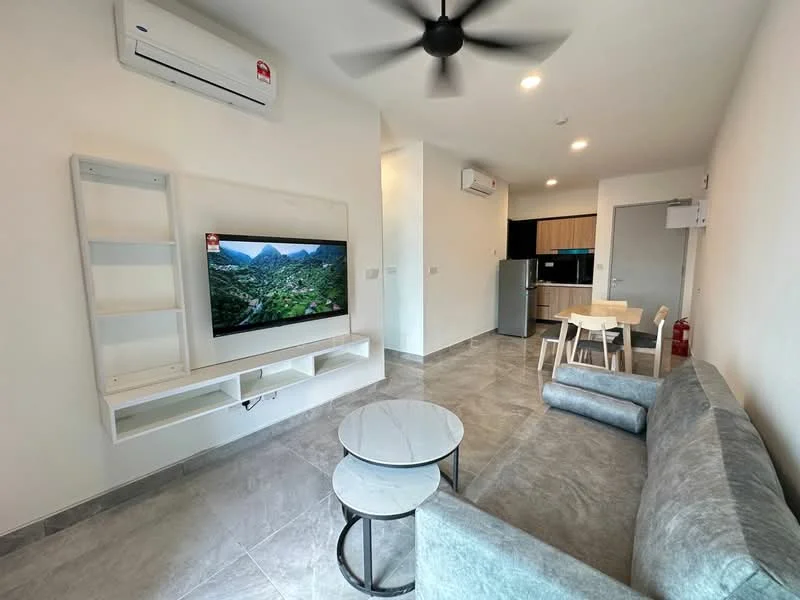 Living features: grey fabric sofa, 2 round coffee tables, wall-mounted TV, white TV console, air conditioning unit, recessed lighting, ceiling fan, marble tile flooring, neutral painted walls; style: modern. Kitchen features: stainless-steel fridge, built-in kitchen cabinets, countertop with bar seating, ceramic tile backsplash, microwave, oven, 4-burner gas hob; style: modern.