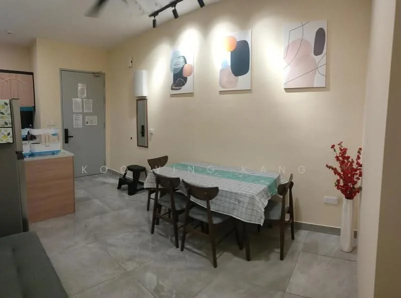 Dining features: dining table with checkered tablecloth, wooden dining chairs, framed abstract artwork on walls, light grey tiled flooring, cream painted walls, wall-mounted light fixtures, decorative red flower arrangement, open kitchen area visible in background; style: modern.