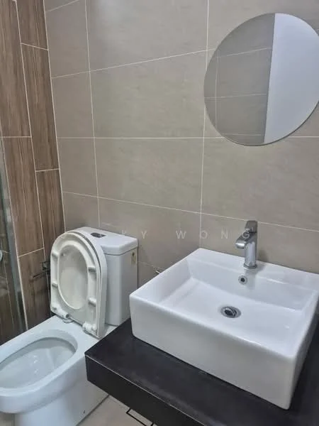 Bathroom features: square white ceramic sink, chrome basin mixer faucet, round mirror, one-piece toilet, wall-mounted toilet tank, grey tiled walls, dark wood vanity, glass shower enclosure; style: modern.
