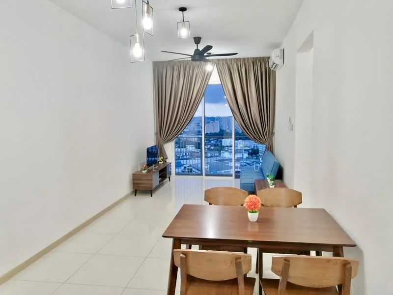 Dining features: dining table with four wooden chairs, pendant lighting fixtures, cream painted walls, white ceiling, floor-to-ceiling windows, curtains in beige, light-colored tiled flooring, wall-mounted TV, sofa in blue, decorative plant on table; style: modern; view: city.