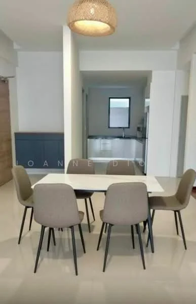 Dining features: 6-seater dining table, white tabletop, black legs on table, upholstered dining chairs in beige, pendant light fixture, cream painted walls, glossy tile flooring, built-in cabinetry in dark wood; style: modern. Room features: open layout, natural light from window, neutral color scheme.