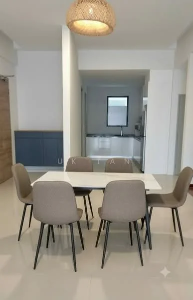 Dining features: 6-seater dining table with white marble top, upholstered dining chairs in beige, pendant light fixture, neutral wall colour, large window providing natural light, open layout leading to kitchen, light-coloured tiled flooring, built-in cabinetry in the background; style: modern.