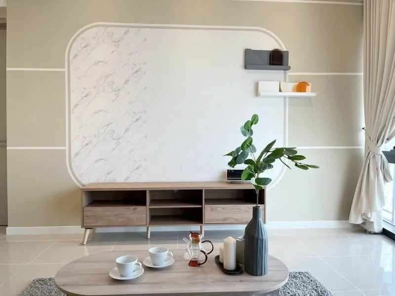 Living features: light grey painted walls, white marble accent wall, light-colored wooden TV console, open shelving unit, decorative items on shelves, large window with sheer curtains, white ceramic coffee table, glass teapot, white candles, dark ceramic vase, green plant in vase, glossy tile flooring; style: modern.