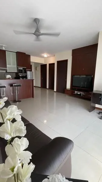Living features: grey leather sofa, coffee table, wall-mounted TV, TV console, recessed downlights, 5-blade ceiling fan, large floor tiles, neutral painted walls, open layout to kitchen, decorative flowers in vase; style: modern. Kitchen features: dark wood cabinetry, stainless-steel fridge, built-in oven, microwave, bar stools, countertop with breakfast bar, ceramic tile backsplash; style: modern. Room features: doorways leading to other rooms, neutral painted walls, light fixtures.