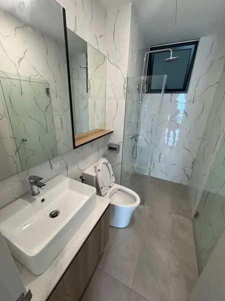 Bathroom features: white ceramic toilet, single-sink vanity with wood cabinet, square white sink, chrome basin mixer faucet, framed mirror, walk-in shower with glass enclosure, rain shower head, marble tile walls with grey veining, light grey tile flooring, wooden shelf above vanity, window for natural light; style: modern.
