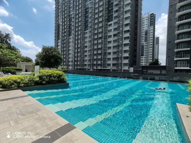 Exterior type: high-rise condominium; features: infinity pool, pool deck with loungers, landscaped garden, mature trees, glass railing, surrounding high-rise buildings, manicured lawn; style: modern.
