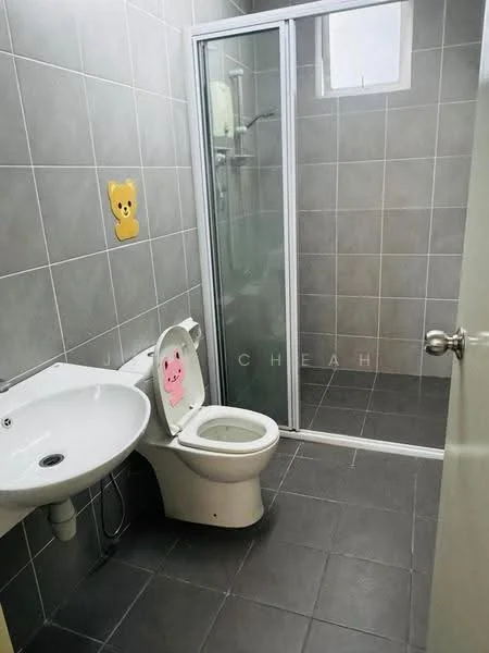 Bathroom features: grey ceramic tile walls, grey ceramic tile flooring, single-sink vanity with white cabinet, chrome basin mixer faucet, one-piece toilet, walk-in shower with glass enclosure, shower head, window for natural light, decorative wall sticker; style: modern.
