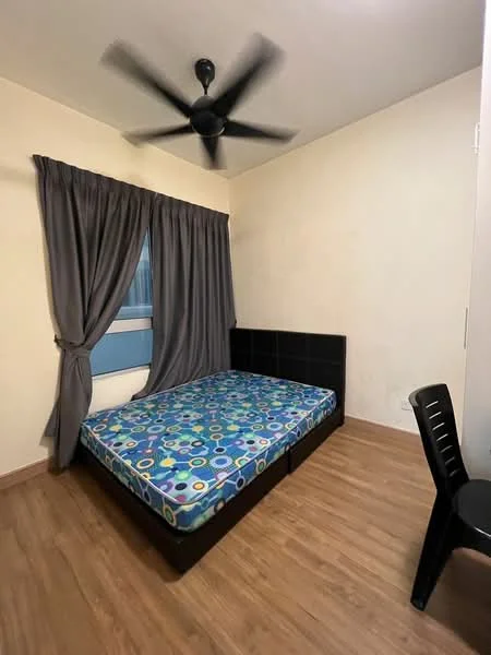 Bedroom features: queen-size bed with colorful patterned mattress, black upholstered bed frame, grey curtains, single window, wooden flooring, ceiling fan, black plastic chair, plain white walls; style: minimalist.