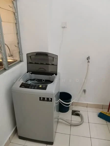Laundry features: top-load washing machine in grey, white tiled flooring, white painted walls, sink with faucet, drainage hose, plastic bucket, window for natural light.