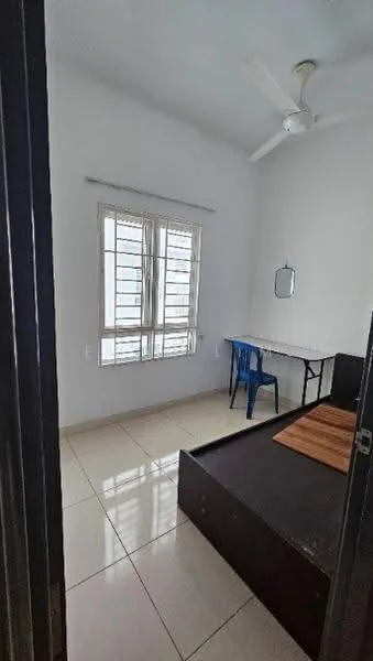 Bedroom features: white painted walls, glossy tile flooring, ceiling fan, window with white frames, single bed frame, wooden bed base, study table, blue plastic chair, mirror on wall.
