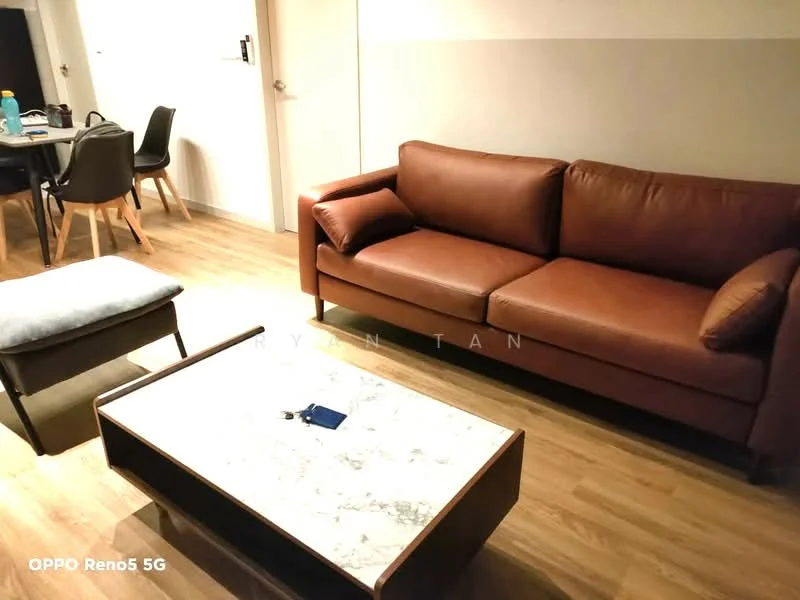 Living features: 3-seater leather sofa in brown, coffee table with marble top, wooden flooring, area rug, wall-mounted TV, dining table in background, 4 dining chairs, decorative items on table; style: modern.