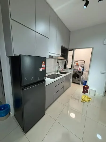 Kitchen features: grey cabinetry, white countertop, stainless-steel sink, chrome pull-down faucet, built-in oven, freestanding fridge in black, ceramic tile flooring, recessed downlights, window with black frame, open shelving, laundry area visible, cleaning supplies on floor; style: modern.