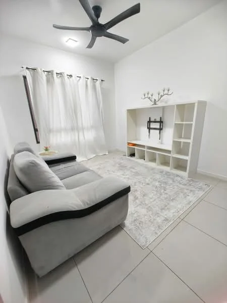 Living features: 3-seater fabric sofa in grey, ceiling fan, white painted walls, light-colored tile flooring, area rug with geometric pattern, built-in shelving unit, curtains, natural light from window; style: modern.