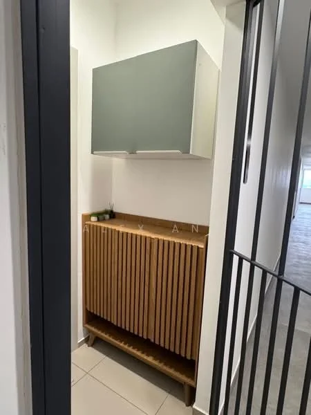 Room features: wooden cabinetry with slatted design, grey upper cabinet, cream tiled flooring, white painted walls, decorative plants on top of cabinet, open hallway view; style: modern.