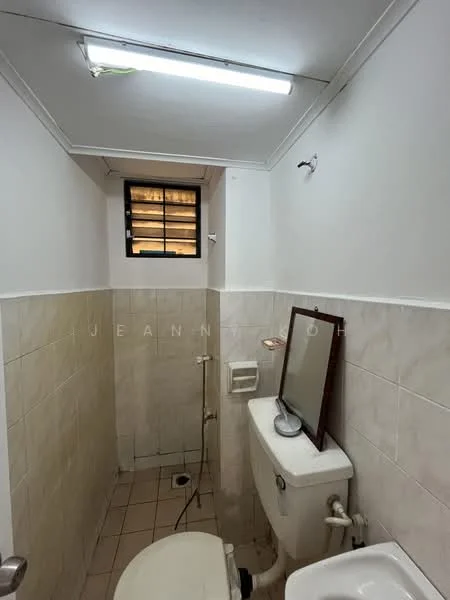 Bathroom features: white tiled walls, cream tiled flooring, one-piece toilet, mirror on wall, shower head, window for natural light, light fixture on ceiling, toilet paper holder.