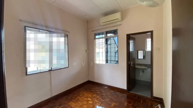 Room features: wooden flooring, white painted walls, 2 windows with metal frames, 1 wall-mounted split AC, door leading to bathroom, ceiling light fixture.