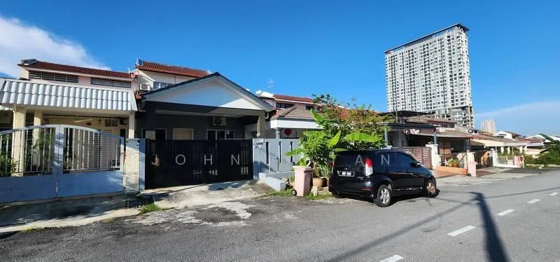 Exterior type: linked terrace house; features: white painted facade, single-storey, manicured lawn, paved driveway, front gate, surrounded by mature greenery, adjacent to high-rise building; style: modern.