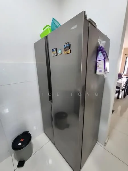 Kitchen features: stainless-steel side-by-side fridge, white tiled walls, glossy white floor tiles, kitchen waste bin, magnetic fridge magnets, green plastic container on top of fridge; style: modern.