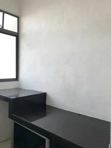 Room features: white painted walls, black countertop, window with grid, flat-panel cabinetry, tile flooring.