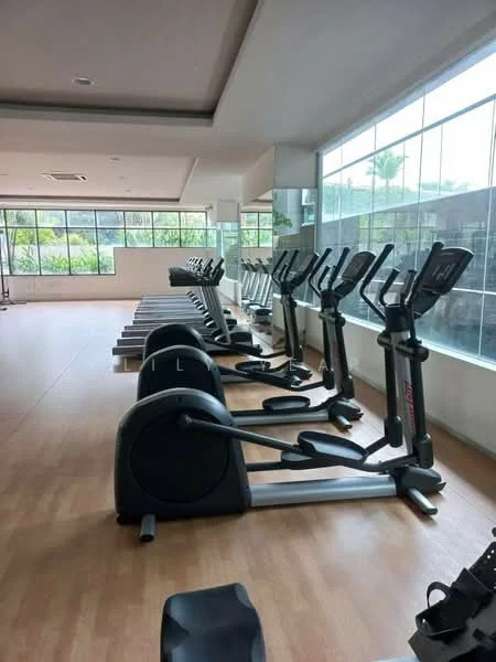 Room features: elliptical machines, exercise bikes, large windows, wooden flooring, mirrored wall, air conditioning unit, natural light, gym equipment, open layout; style: modern; view: garden.