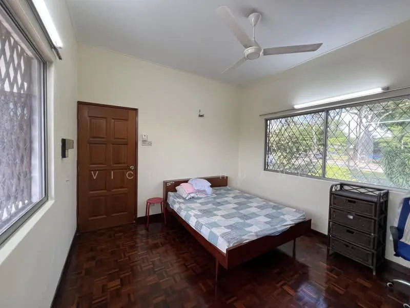 Bedroom features: single bed with mattress, wooden bed frame, ceiling fan, window with security grille, wooden door, laminate flooring, built-in wardrobe, light fixtures on wall; view: garden.