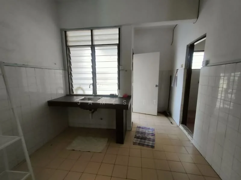 Kitchen features: single-bowl stainless-steel sink, chrome pull-down faucet, black countertop, white tiled walls, cream tiled flooring, window with horizontal slats, open shelving, door leading to another room.